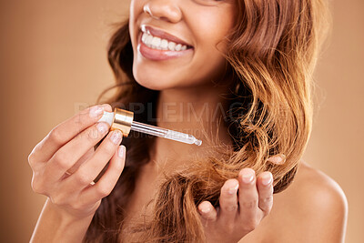 Buy stock photo Woman, hair and oil serum dropper in hands, beauty with cosmetic care product on studio background. Balayage, split ends treatment with pipette zoom, cosmetology and female with smile and haircare
