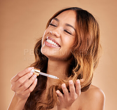 Buy stock photo Happy woman, hair and oil serum, beauty with cosmetic care and product on studio background. Balayage, split ends treatment with pipette or dropper, cosmetology and female with smile and haircare