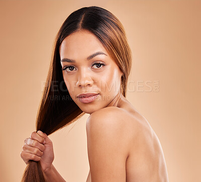 Buy stock photo Woman, beauty and hair care portrait for growth and shine shampoo on a brown background. Aesthetic female in studio for natural keratin treatment and skincare wellness with color and strong texture