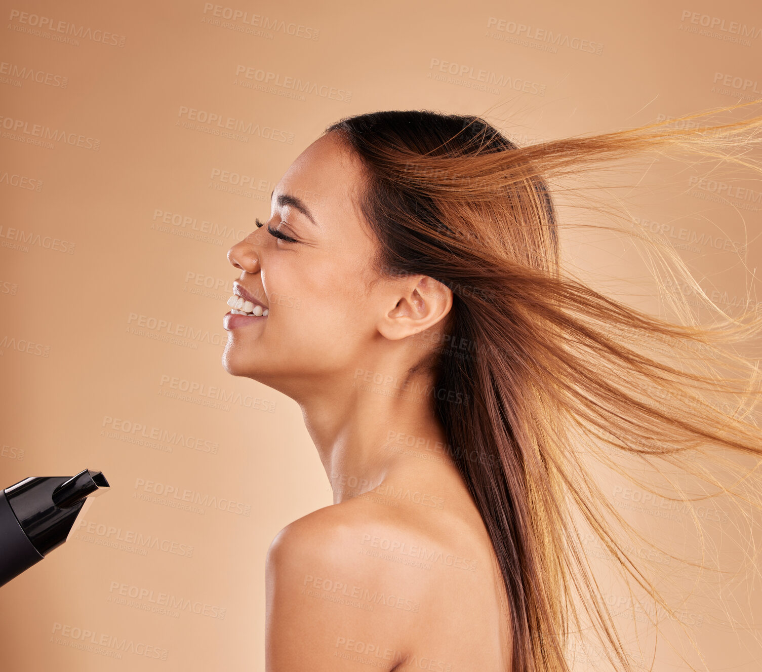 Buy stock photo Hairdryer, beauty and hair care with a woman in studio for growth or shine with strong texture. Aesthetic female laugh on brown background with blow dryer and heat protect for healthy color profile