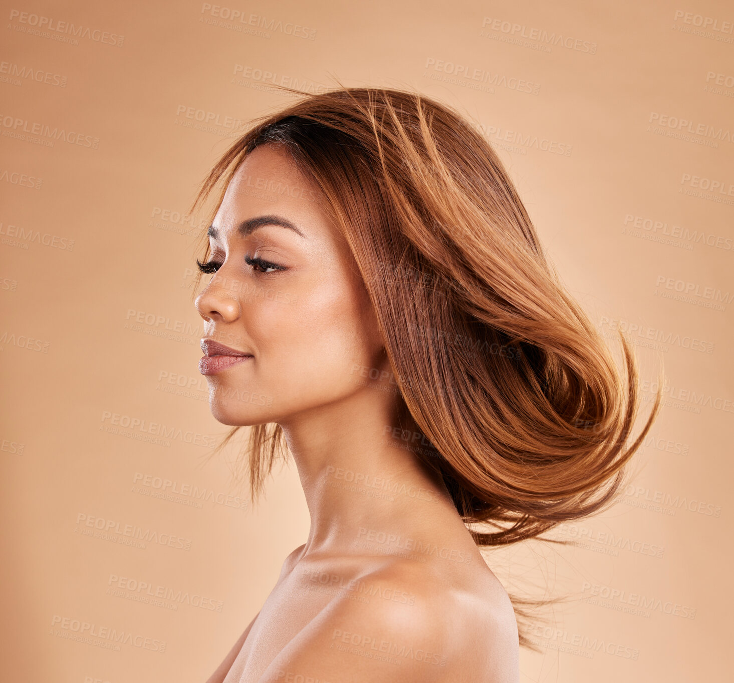 Buy stock photo Beauty, hair and salon with a model black woman in studio on a beige background for keratin treatmet. Face, haircare or shampoo and an attractive young female posing with the wind in her hairstyle