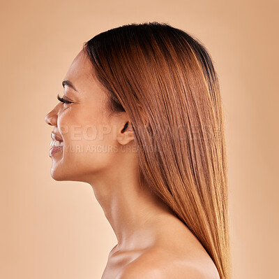 Buy stock photo Woman, beauty and hair care profile with a smile for growth and shine shampoo on a brown background. Aesthetic female happy in studio for natural keratin treatment and wellness with color and texture