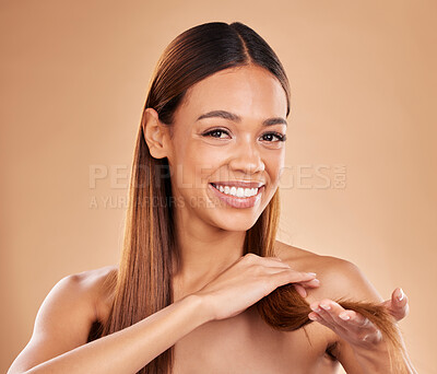 Buy stock photo Woman, portrait and happy with hair texture with growth and shine shampoo on a brown background. Aesthetic female excited in studio for natural keratin treatment and wellness with self care and smile