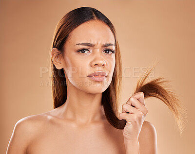 Buy stock photo Hair care, frustrated and portrait of a woman with split ends isolated on a studio background. Unhappy, frizzy and a girl with a problem with damaged, tangled and breakage of a hairstyle on backdrop