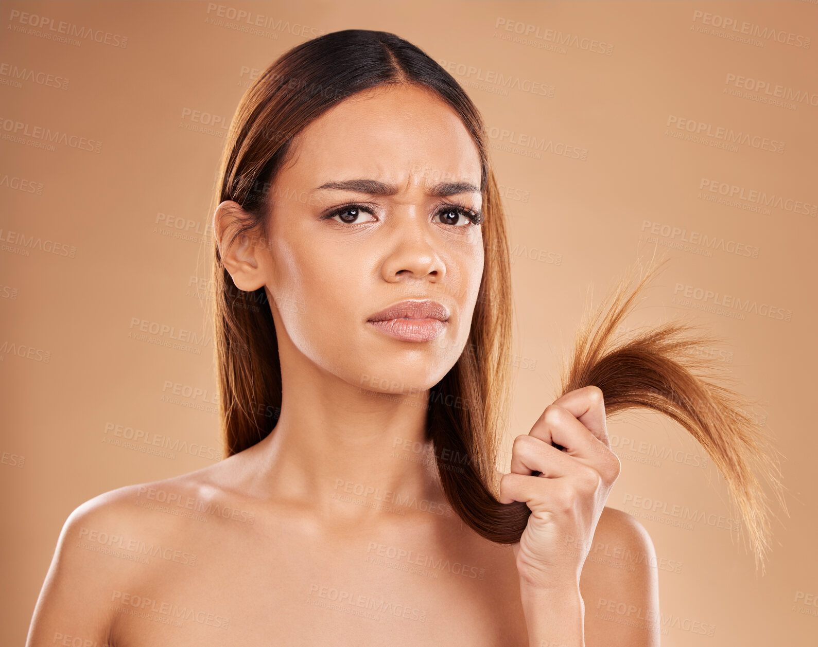 Buy stock photo Hair care, frustrated and portrait of a woman with split ends isolated on a studio background. Unhappy, frizzy and a girl with a problem with damaged, tangled and breakage of a hairstyle on backdrop