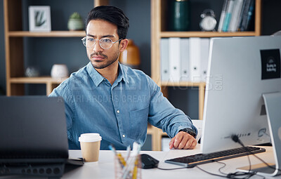 Buy stock photo Serious, laptop and business man in office for startup management, digital planning and trading. Focused male worker at computer technology for online project, website and internet research at table