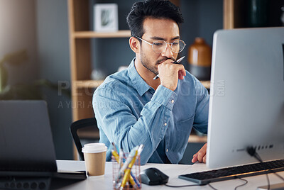 Buy stock photo Serious, business man and thinking on computer in office, internet research and website. Focused male employee, desktop and solution of ideas, planning decision and review strategy, project or vision