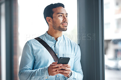 Buy stock photo Phone, thinking and man by office window for career inspiration, job search or online networking. Contemplating asian person or young entrepreneur cellphone, smartphone or mobile app in workplace