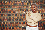 Pointing, mockup and portrait of black woman and wall background for announcement, product placement and offer. Idea, news and deal with female and hand gesture for information, opportunity and show