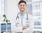 Smile, doctor and portrait of man in hospital with crossed arms for wellness, medicine and medical care. Healthcare, insurance and happy health worker in clinic for consulting, trust and stethoscope