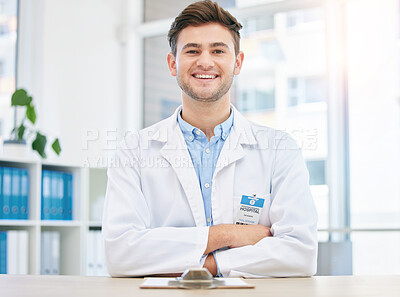 Buy stock photo Medical, smile and portrait of happy doctor in a hospital office feeling happy, excited and proud in a clinic. Young, medicine and man healthcare professional arms crossed satisfied with health