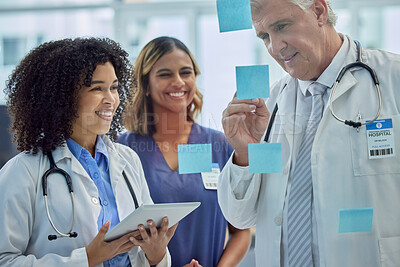 Buy stock photo Planning, training and doctors teamwork on glass board for healthcare management and internship workflow on sticky note. Medical students, people or woman with manager writing ideas for clinic goals