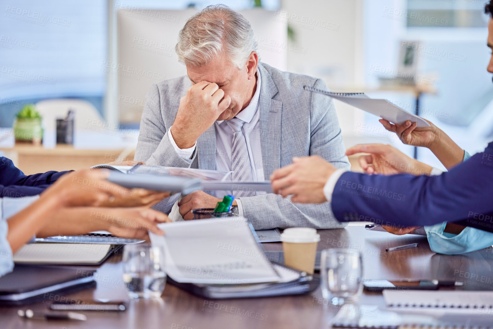 Buy stock photo Businessman in meeting with headache, burnout or stress with mental health emergency in work office. Senior company manager with anxiety, sick and frustrated with migraine pains, problems or fatigue