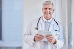 Portrait, man and doctor with tablet, healthcare and career with success, connection and research in hospital. Face, mature male and medical professional with technology, online reading and diagnosis
