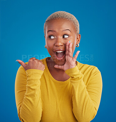 Buy stock photo Black woman, gossip and secret in studio with hand on face for sale announcement. African female model on a blue background to whisper message, news information or wow rumor pointing at mockup deal