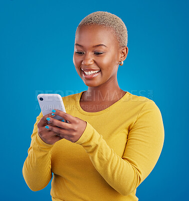 Buy stock photo Phone, typing and black woman in studio with smile for social media, text message and browse website. Communication mockup, technology and girl on internet, network and chat online on blue background