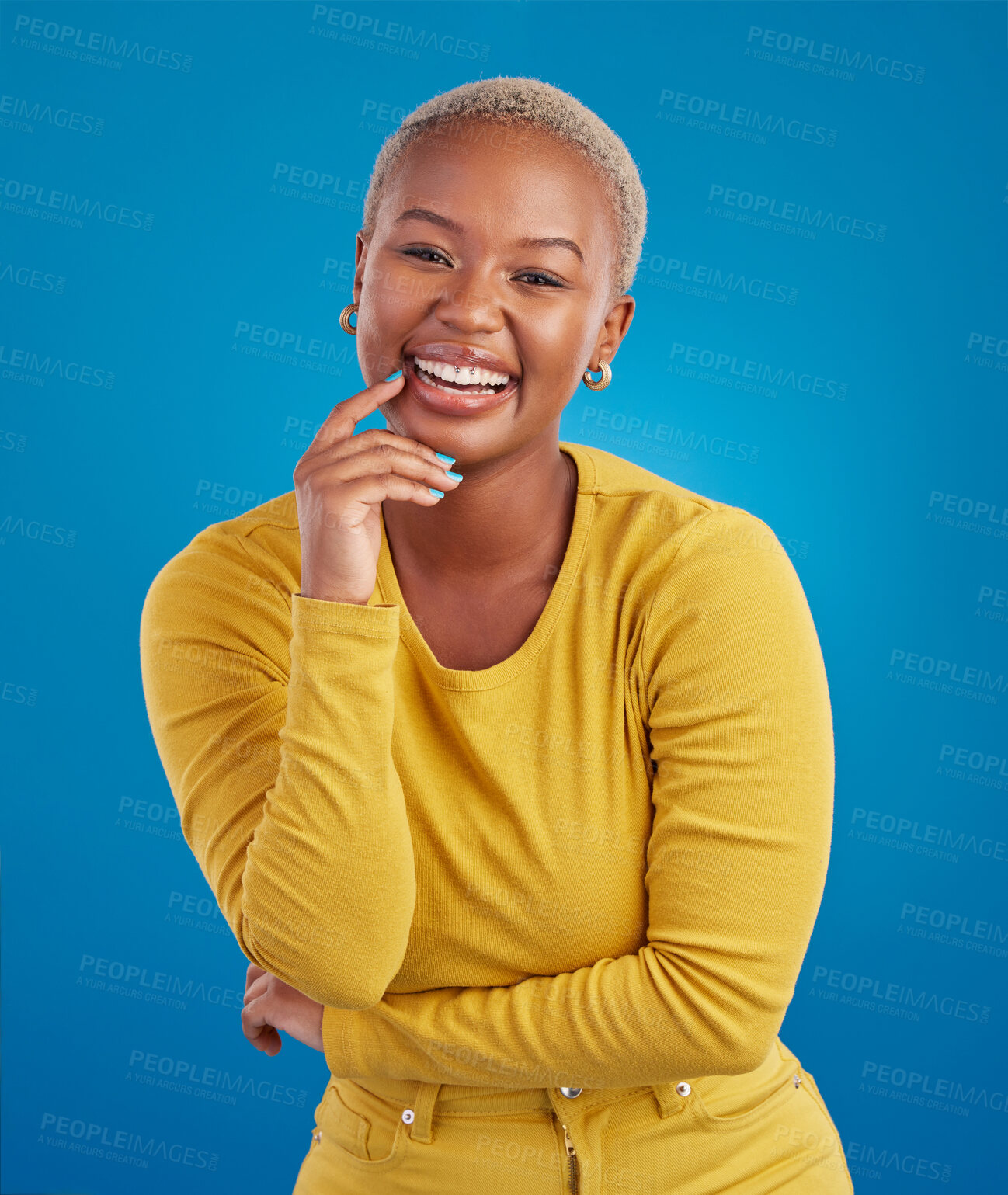 Buy stock photo Portrait, happy and black woman in studio smile, cheerful and laughing on mockup, space or blue background. Face, joy and female laugh, joke and silly humor, carefree and having fun while isolated