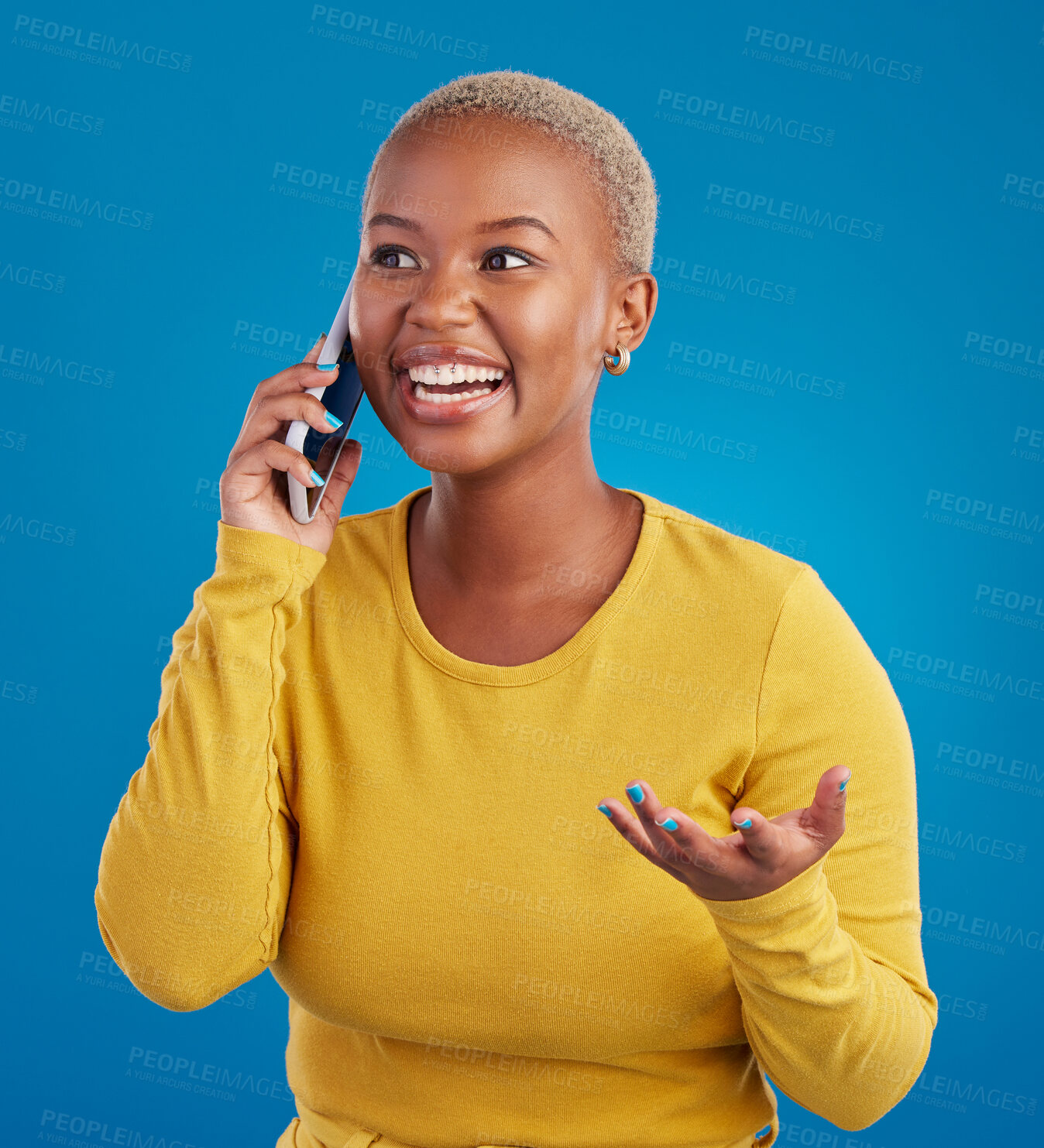 Buy stock photo Phone call, excited and black woman talking in studio for social network, connection and conversation. Communication mockup, smartphone and surprised girl speaking, smile and chat on blue background