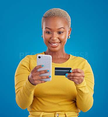 Buy stock photo Online shopping, credit card and black woman with phone in studio for ecommerce on blue background. Debit, fintech app and girl with subscription, membership or budget, payment and banking