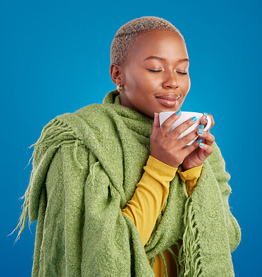 Buy stock photo Coffee, scent and a black woman on a blue background in studio smelling the aroma for her mug. Relax, drink and easy with an attractive young female enjoying a fresh cup of caffeine during a break