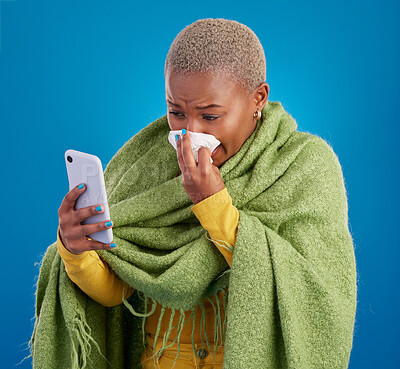 Buy stock photo Sick black woman, phone and blowing nose on background, studio and allergies from winter virus. Female model, influenza and smartphone for telehealth app, covid healthcare and search symptoms online