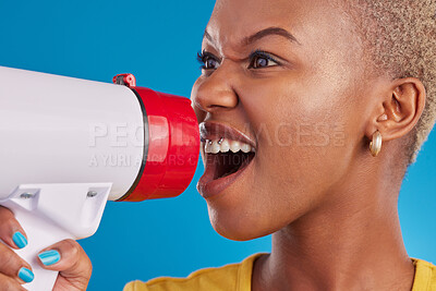 Buy stock photo Megaphone, shouting and face of black woman in studio for message, broadcast or vote on blue background. Speaker, microphone and girl protest for change, democracy and justice, noise or womens rights