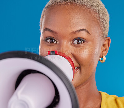 Buy stock photo Megaphone, opinion and speaker with black woman in studio for change, democracy and protest. Vote, announcement and message with female isolated on blue background for empowerment, strike and choice