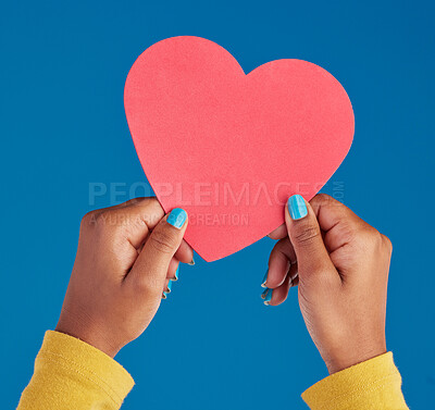 Buy stock photo Paper, heart and hands of black woman in studio for love, date and kindness. Invitation, romance and feelings with female and shape isolated on blue background for emotion, support and affectionate