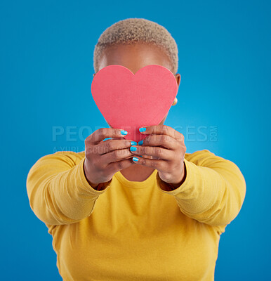 Buy stock photo Paper, heart and cover with black woman in studio for love, date and kindness. Invitation, romance and feelings with female and shape isolated on blue background for emotion, support and affectionate