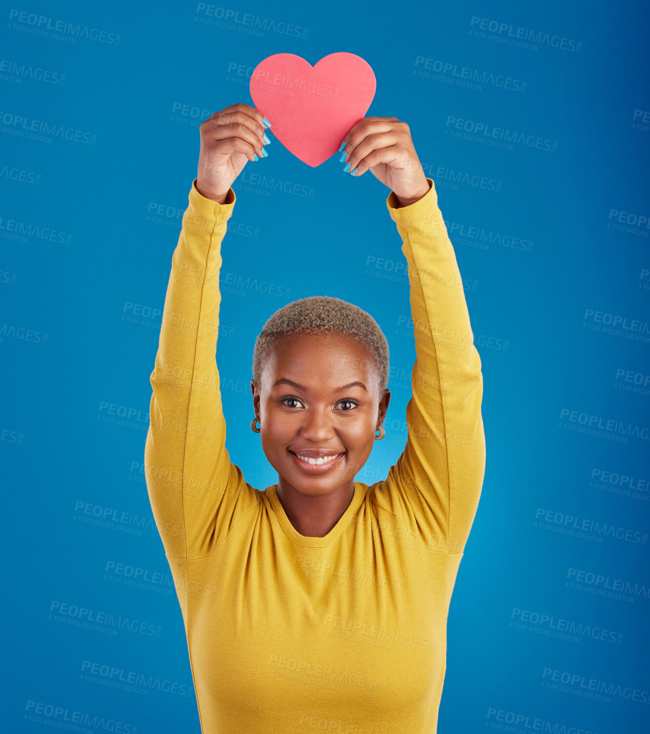 Buy stock photo Paper, heart and portrait of black woman in studio for love, date and kindness. Invitation, romance and feelings with female and shape isolated on blue background for emotion, support or affectionate