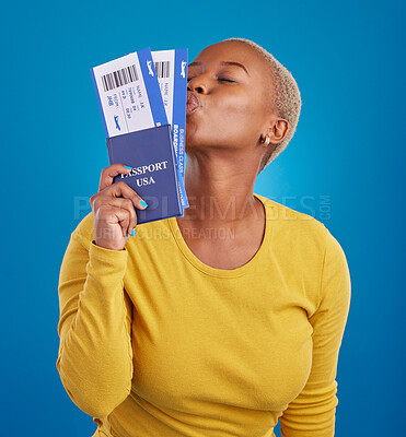 Buy stock photo Kiss, travel passport and black woman in studio on blue background for flight documents, tickets and ID. Traveling mockup, happy and girl celebrate immigration, USA holiday and international vacation