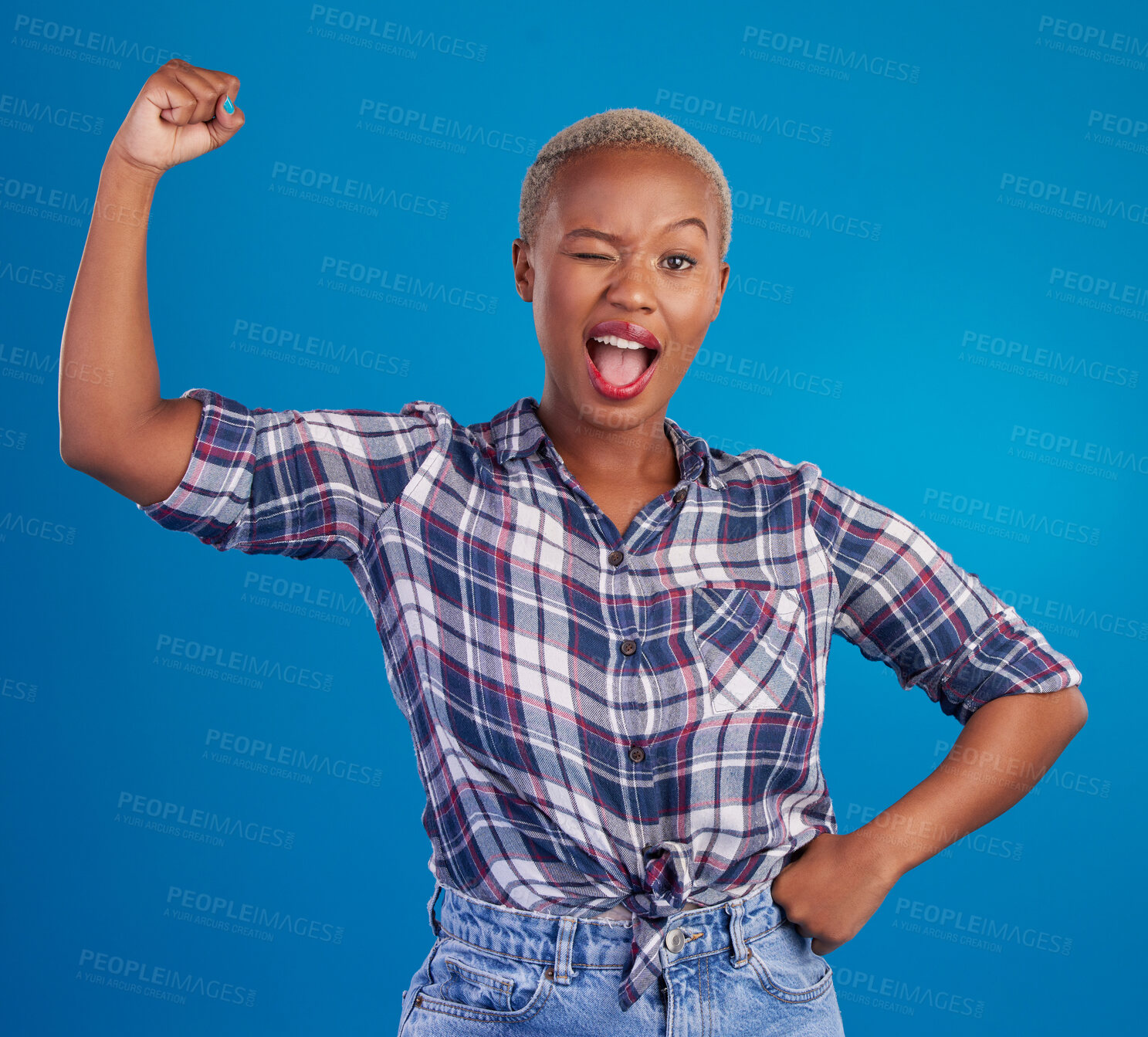 Buy stock photo Wink, arm flex and portrait of black woman in studio for empowerment, confident and success. Achievement, hard work and pride with female isolated on blue background for power, strong or motivation