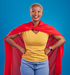 Black woman, superhero cape and portrait in studio, blue background and fashion. Happy female model, superwoman and brave cosplay character of justice, smile and pride of girl power, proud and strong