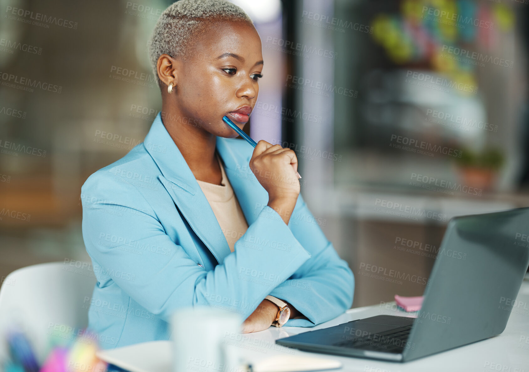 Buy stock photo Laptop, thinking and a business black woman at work in her office on a review, proposal or project. Serious, focus and idea with a female employee reading an email or doing research while working 