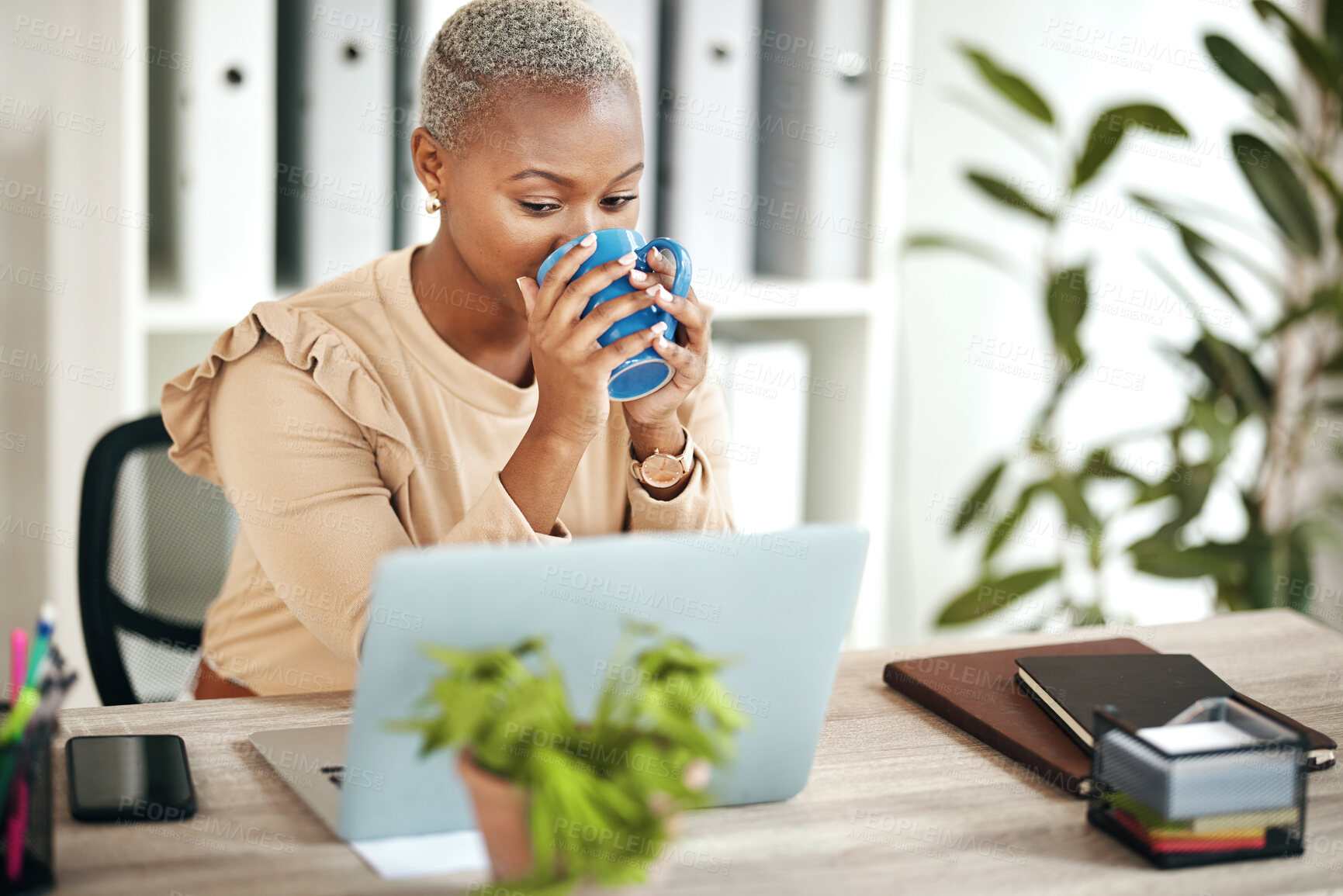 Buy stock photo Black woman, business and coffee at laptop on desk in office reading email online with internet. Entrepreneur female person drinking tea and planning schedule or work while thinking about search