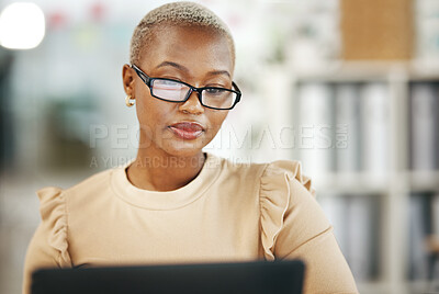 Buy stock photo Office, laptop and black woman with glasses, internet research and checking online report or email. Computer, concentration and serious, African journalist working on article on digital news website
