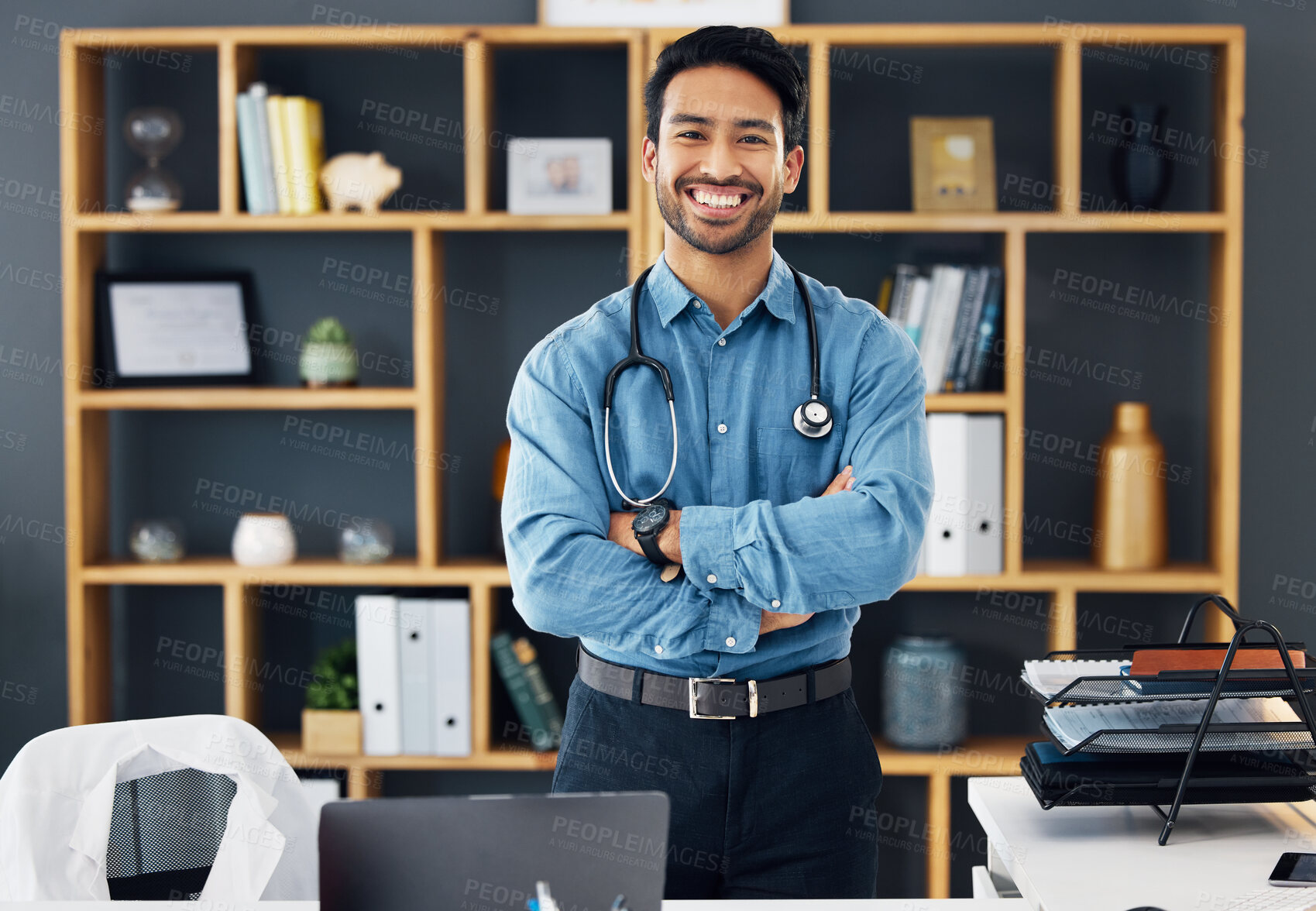 Buy stock photo Portrait, healthcare and man with arms crossed, hospital and happiness with development, medicine and research. Face, medical professional and happy male employee with confidence, wellness or success
