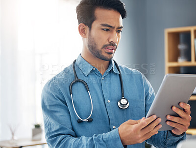 Buy stock photo Tablet, serious man and doctor in healthcare office for telehealth, solution and research. Digital technology, unsure or confused medical worker and data analysis for online test results of clinic 