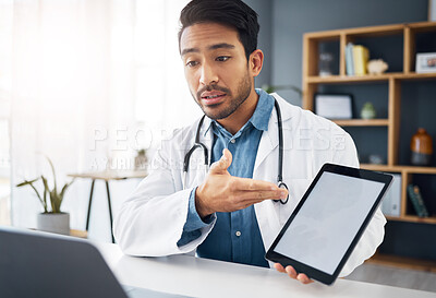 Buy stock photo Mockup, consultation and a doctor on a video call with a tablet for results, healthcare support and advice. Talking, consulting and an Asian gp with a blank screen tech for a telehealth webinar