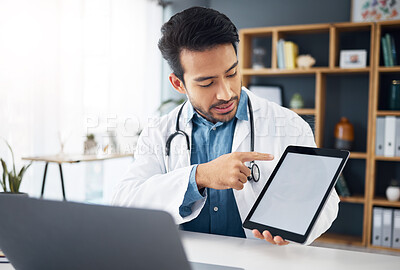 Buy stock photo Mockup, explaining and a doctor on a video call with a tablet for results, healthcare support and advice. Talking, consulting and an Asian gp with a blank screen tech for a telehealth webinar