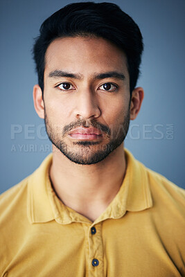 Buy stock photo Focus, serious and portrait of a male in studio with moody, sadness or mental health problem. Tired, concentrating and Indian man model with burnout face expression isolated by gray background.