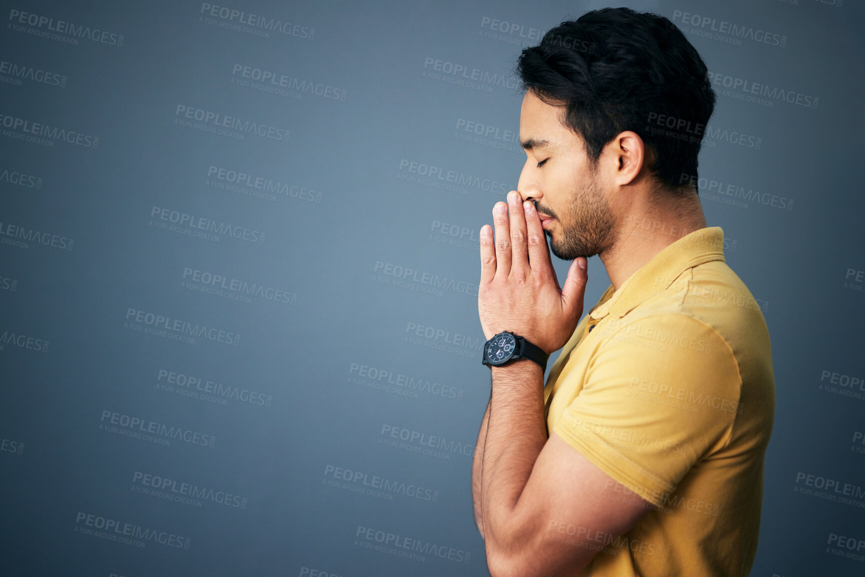 Buy stock photo Pray, faith and mockup with a man in studio on a gray background asking god for a miracle or help. Trust, religion and spiritual with a handsome young male christian praying to jesus in belief