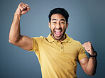 Indian man, celebration fist and studio portrait for winning mindset, happiness or achievement by background. Young model, male student and celebration with happy, excited face or winning by backdrop