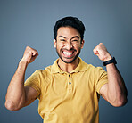 Indian man, excited celebration and studio portrait for winning mindset, happiness or achievement by background. Young model, male student or celebration with happy, fist and winner with motivation