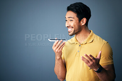 Buy stock photo Mockup, phone call and Asian man with speaker, conversation and connection against a studio background. Japan, male and guy with smartphone, talking and discussion with network signal and happiness