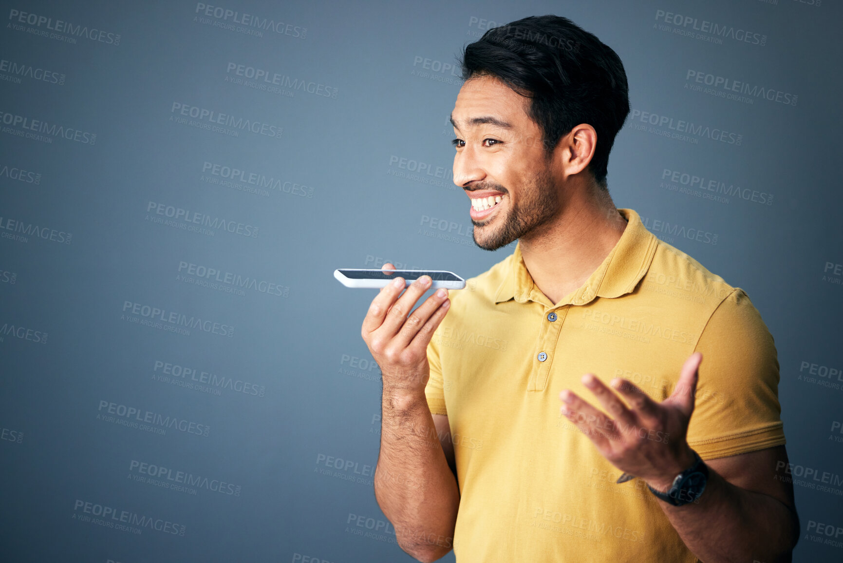 Buy stock photo Mockup, phone call and Asian man with speaker, conversation and connection against a studio background. Japan, male and guy with smartphone, talking and discussion with network signal and happiness