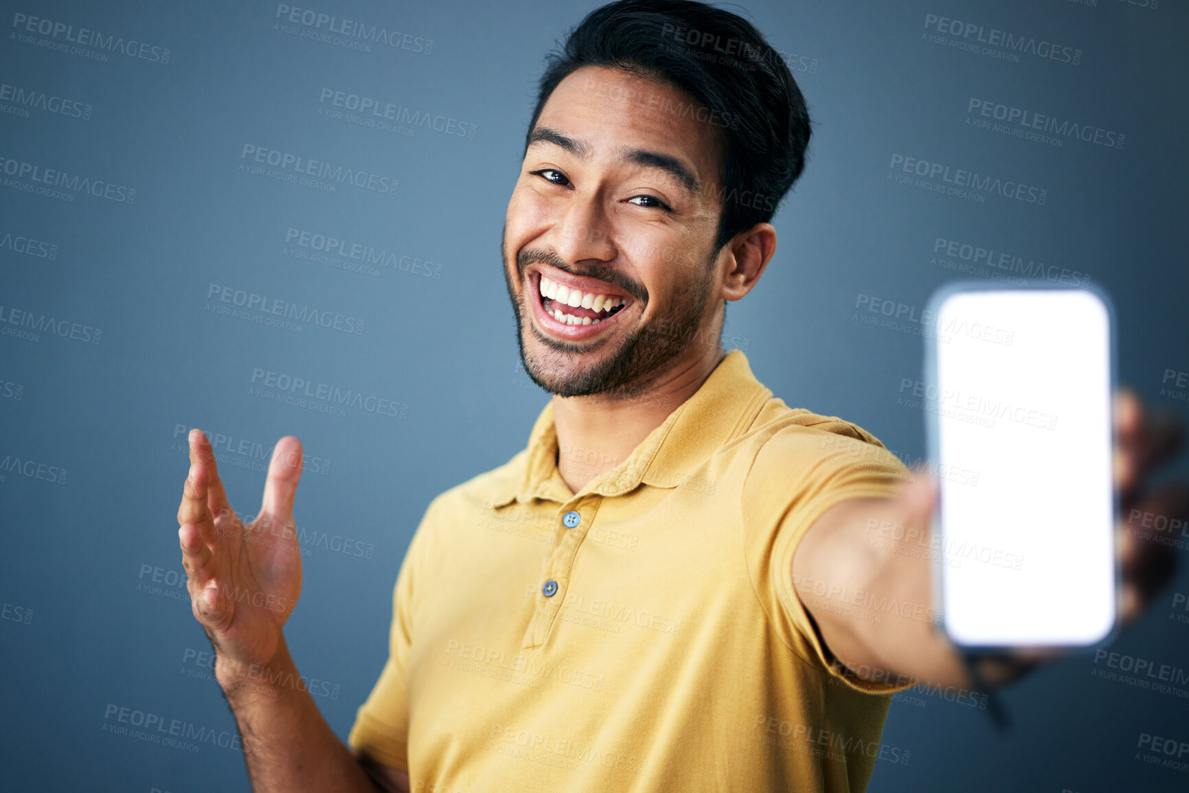 Buy stock photo Phone mockup, studio portrait and happy man with online ui for product placement, branding copy space or marketing. Advertising mock up, white screen cellphone and excited person on blue background