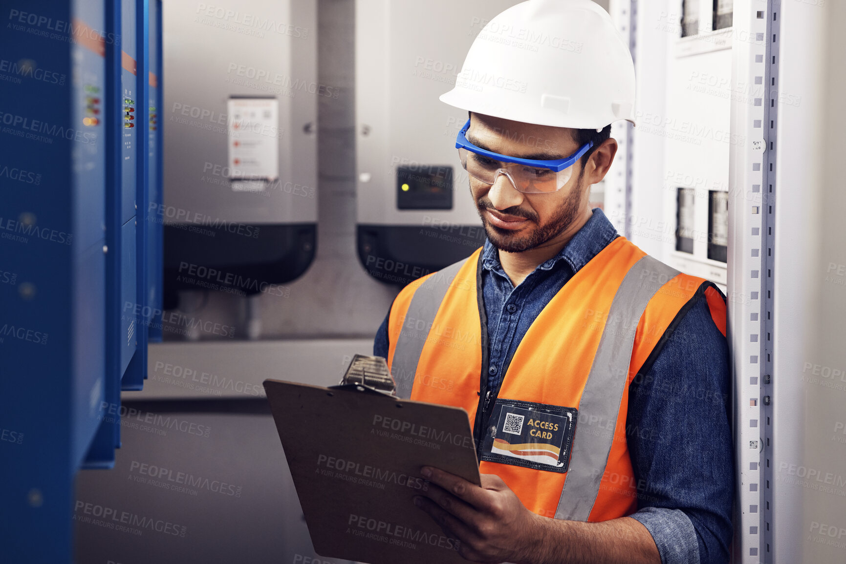 Buy stock photo Man, electricity and technician in control room, writing notes and machine maintenance on clipboard. Male electrician, system and electrical substation for power, engineering inspection and checklist