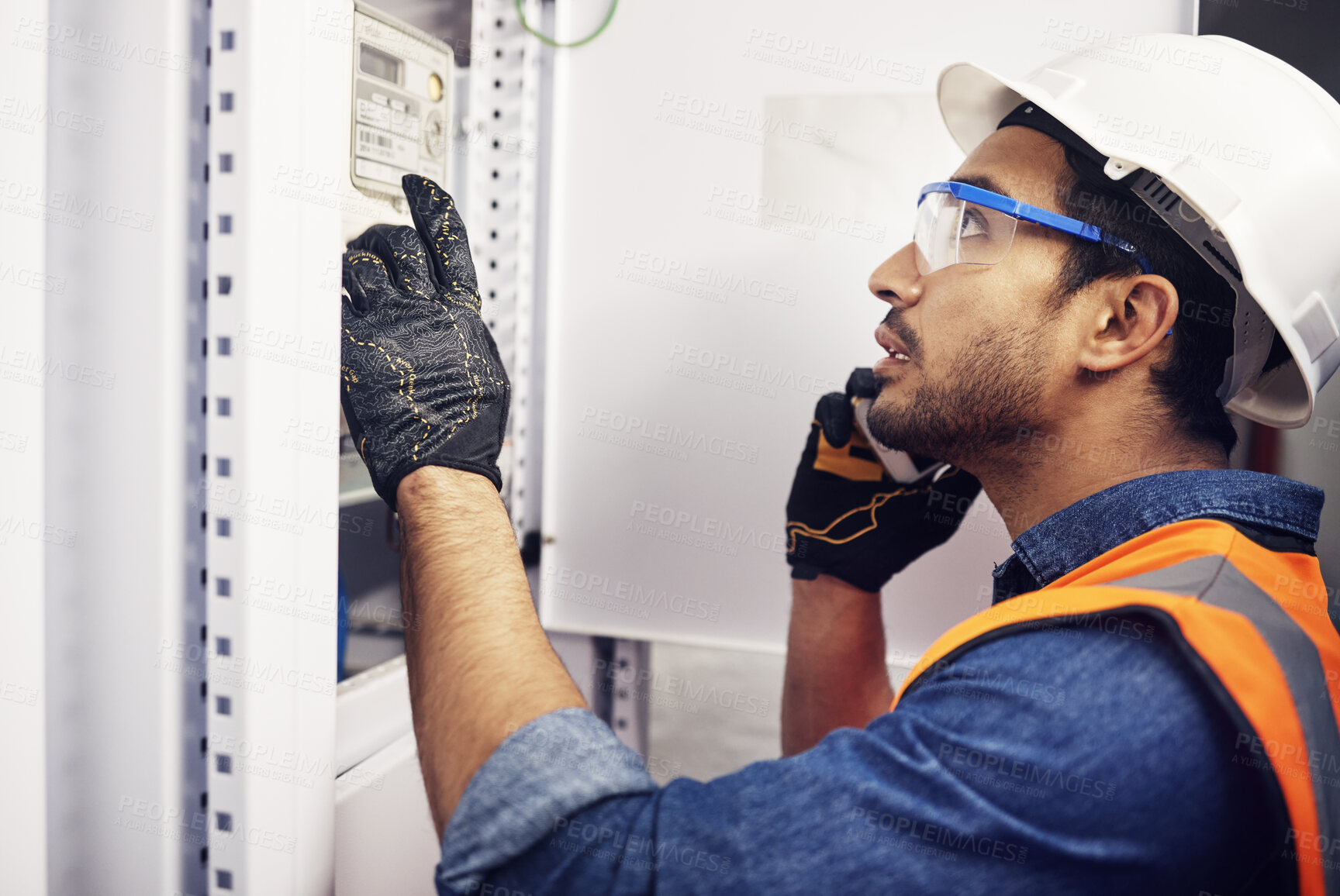 Buy stock photo Man, phone call and engineering in control room, switchboard and power box inspection. Male electrician talking on smartphone at power box, server mechanic and electrical substation maintenance 