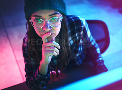Buy stock photo Cyber security, focus and woman hacker working on a computer in the basement at night for phishing. Database, password and ransomware with a female coder hacking a digital transformation network
